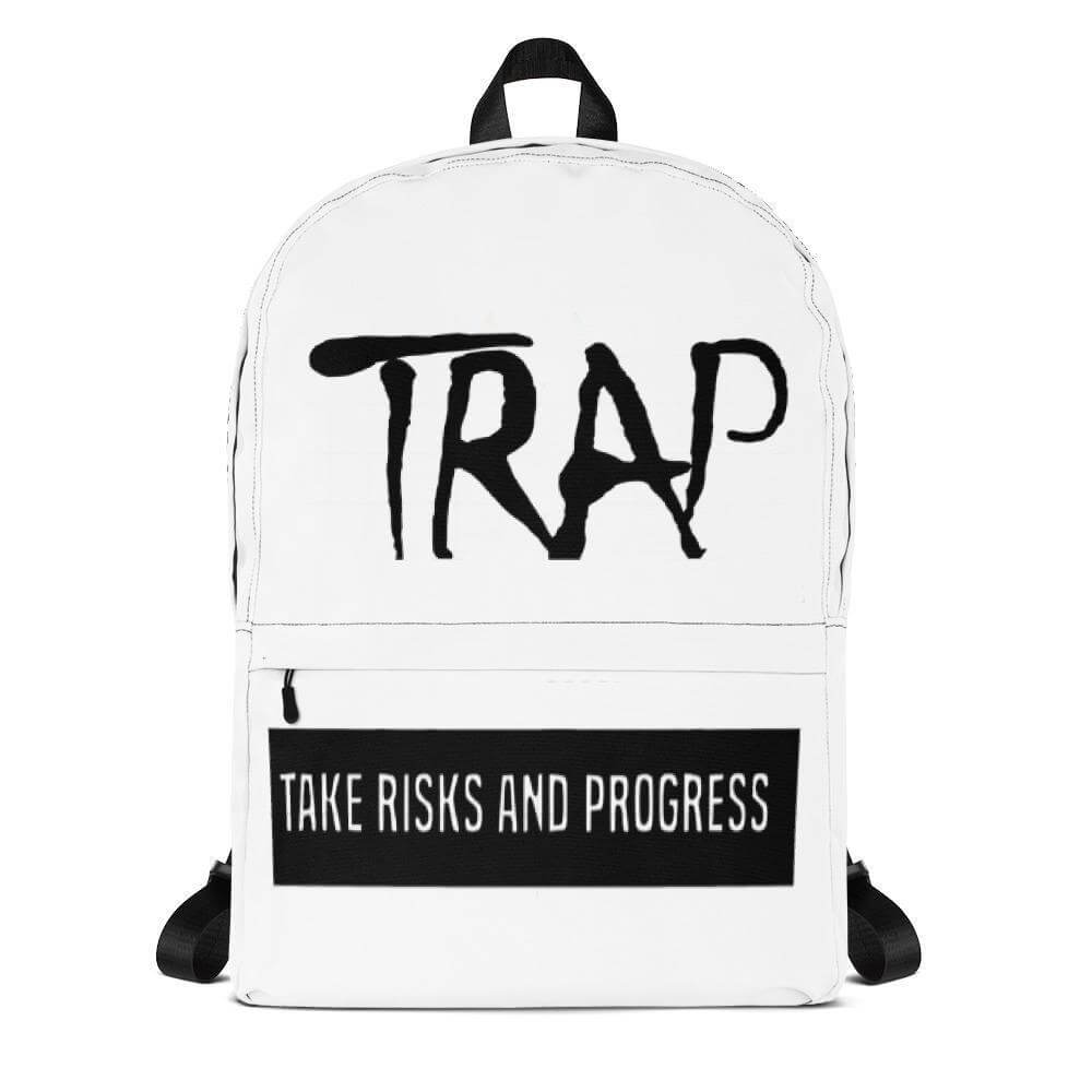 White backpack with the text 'TRAP' and 'TAKE RISKS AND PROGRESS' for stylish and motivational accessories.