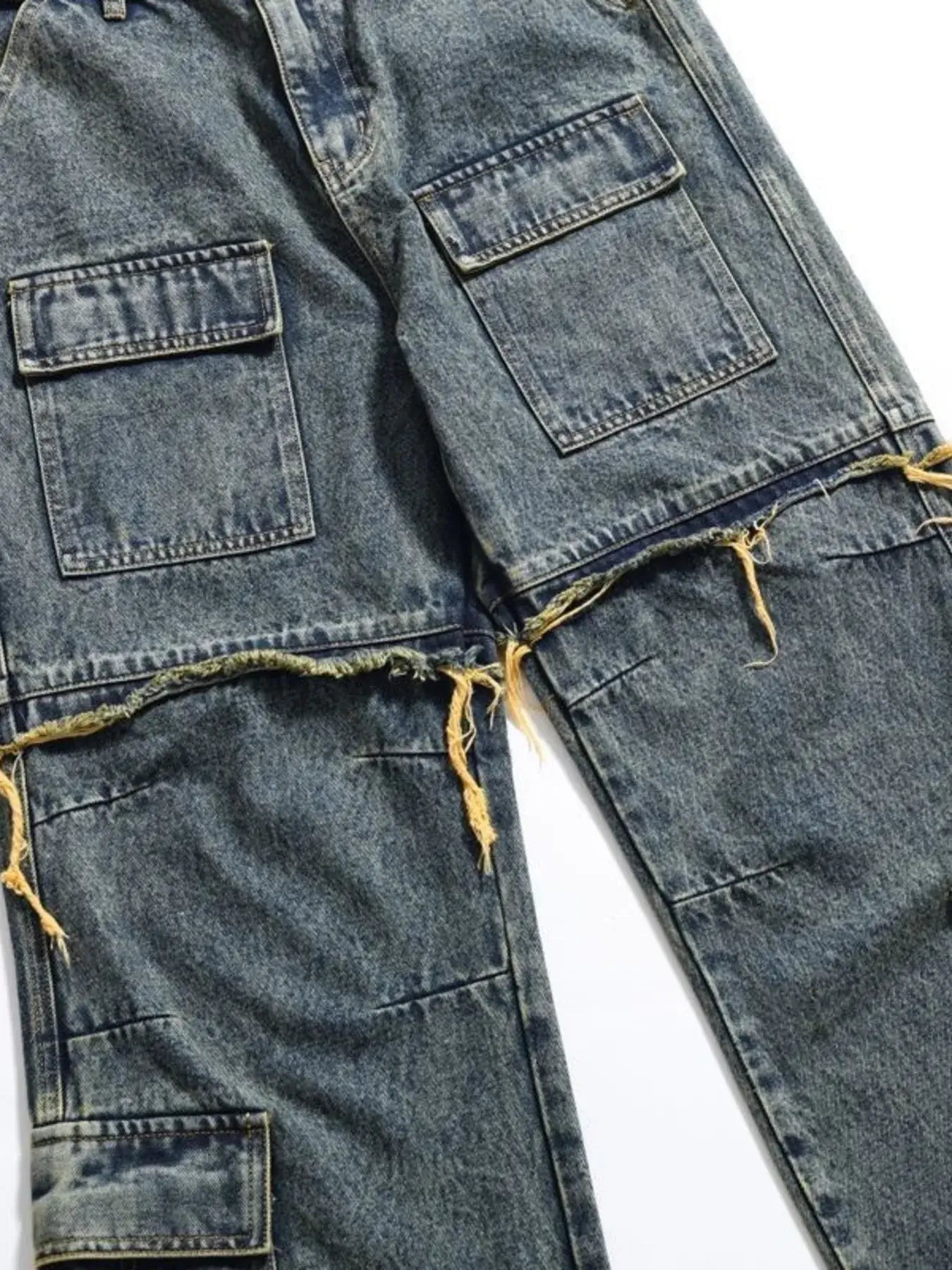 Vintage distressed multi-pocket cargo jeans for men with frayed hem and multiple large pockets.