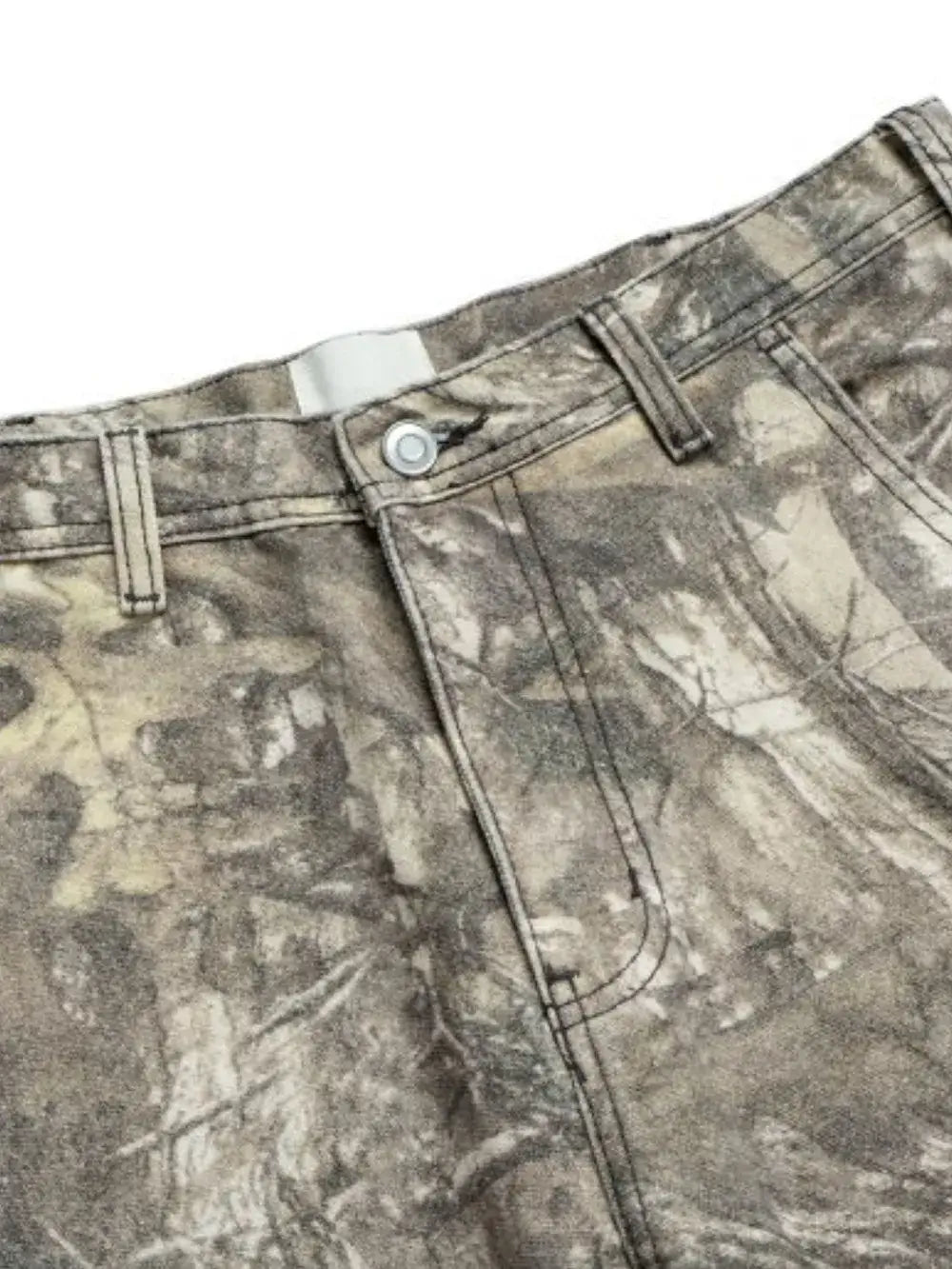 Close-up of Twig Camouflage Distressed Jeans showing the fabric detail and button closure.