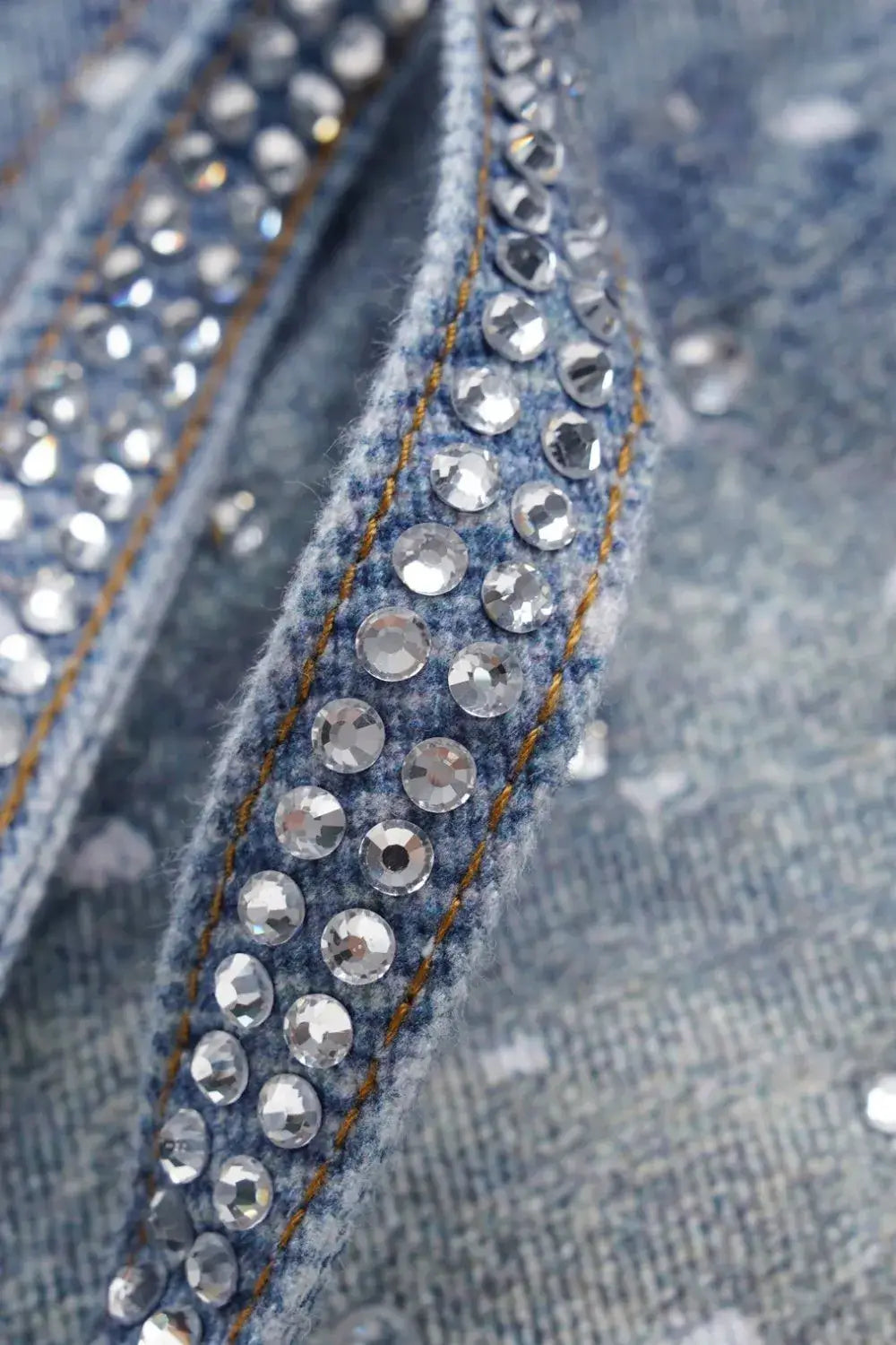 Close-up of Galaxy Rhinestone Jeans showcasing 20K genuine rhinestones on a 3D washed denim texture.